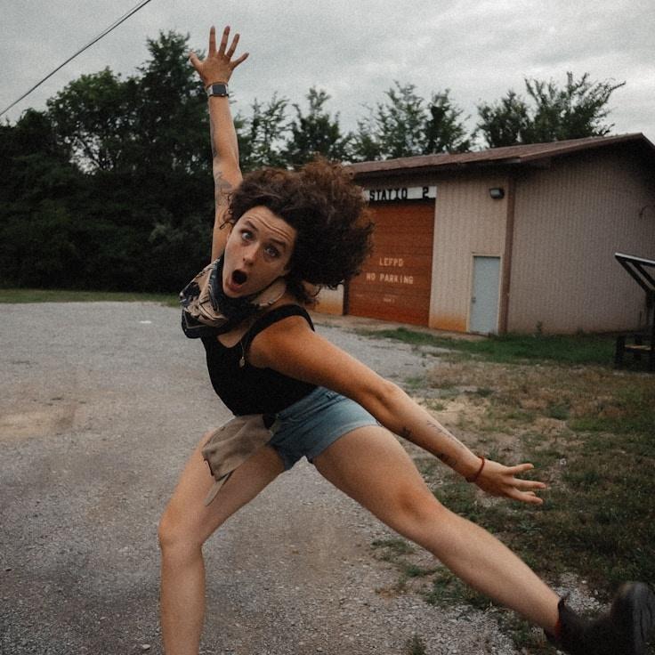 Kaveri Mehta, Lead Design Curator at Crest Grove Harbor, reviewing corporate floral arrangements